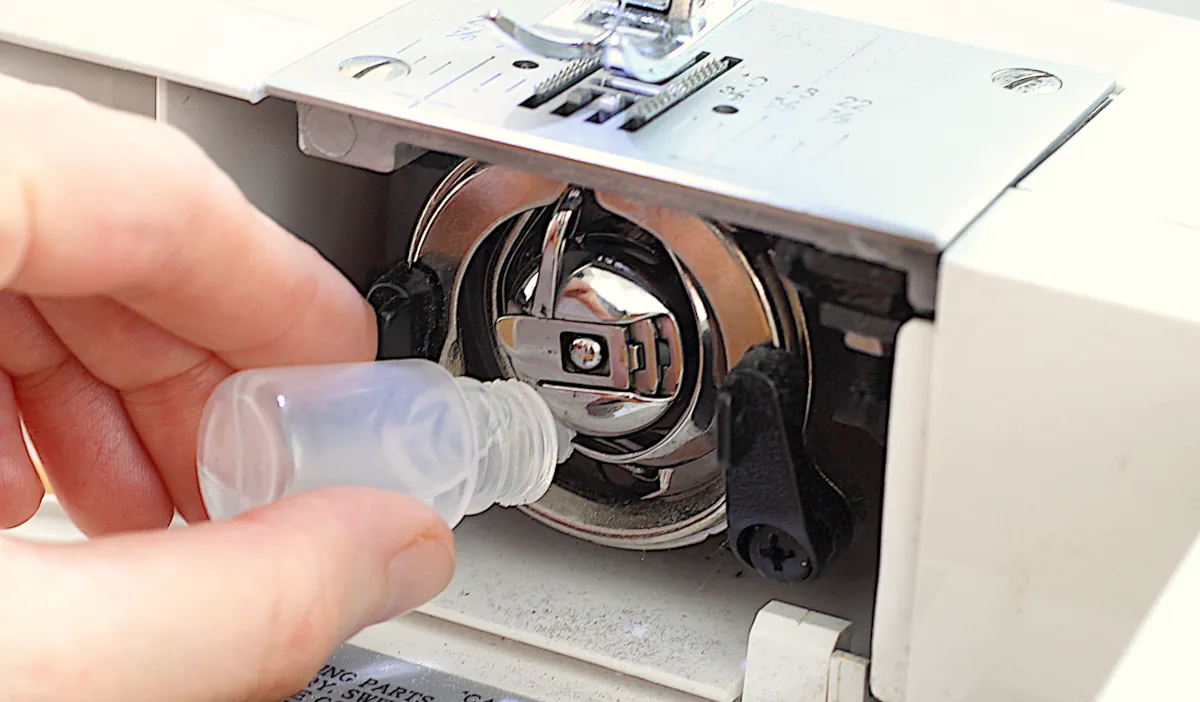 applying oil to a sewing machine